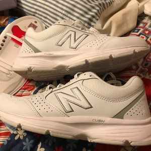 New Balance white with silver/gray trim. 8.5 wide. Worn a couple times outside